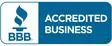 A blue sign that says accredited business.